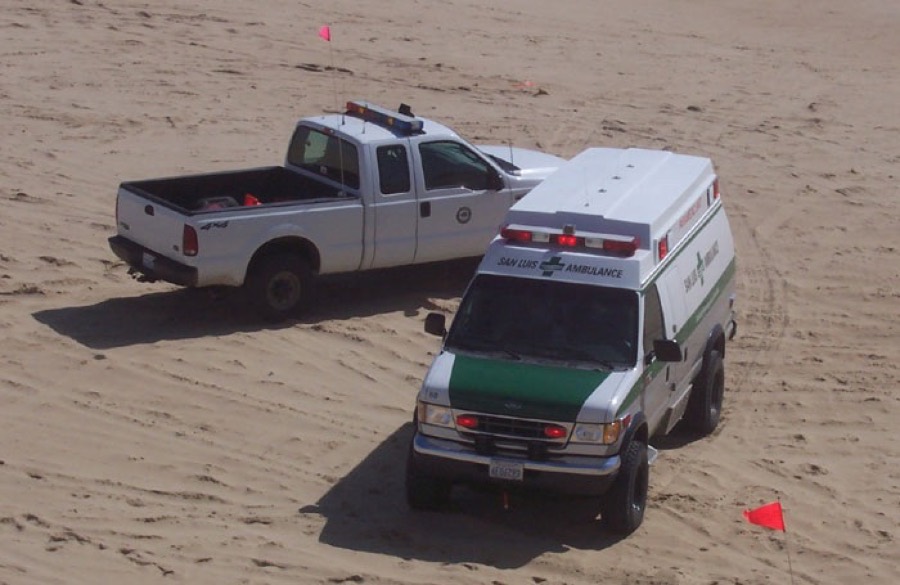San Luis Ambulance and ranger truck on the beach