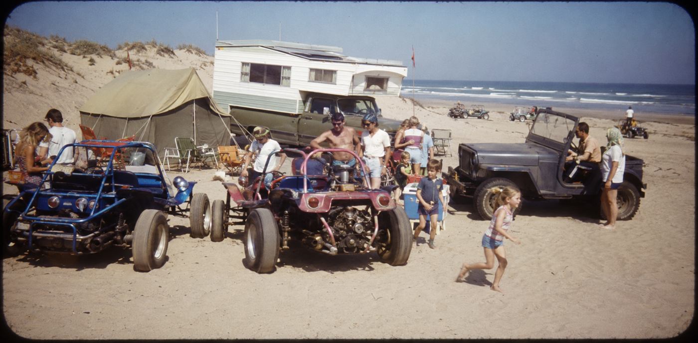 AI recreation styled after 1970s photographs of families and dune buggies camped on the beach at Oceano Dunes