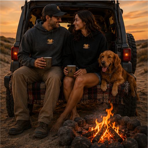 A couple sitting on a tailgate with a golden retriever, showing the Sunset Collection badge on the front of their hoodies, Oceano Dunes California