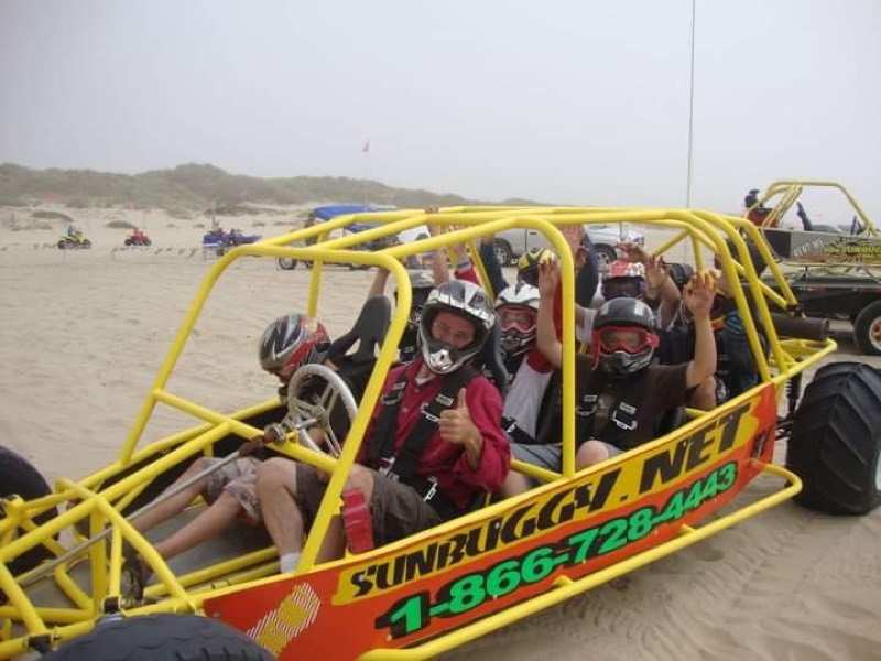 Family in a rented yellow dune buggy